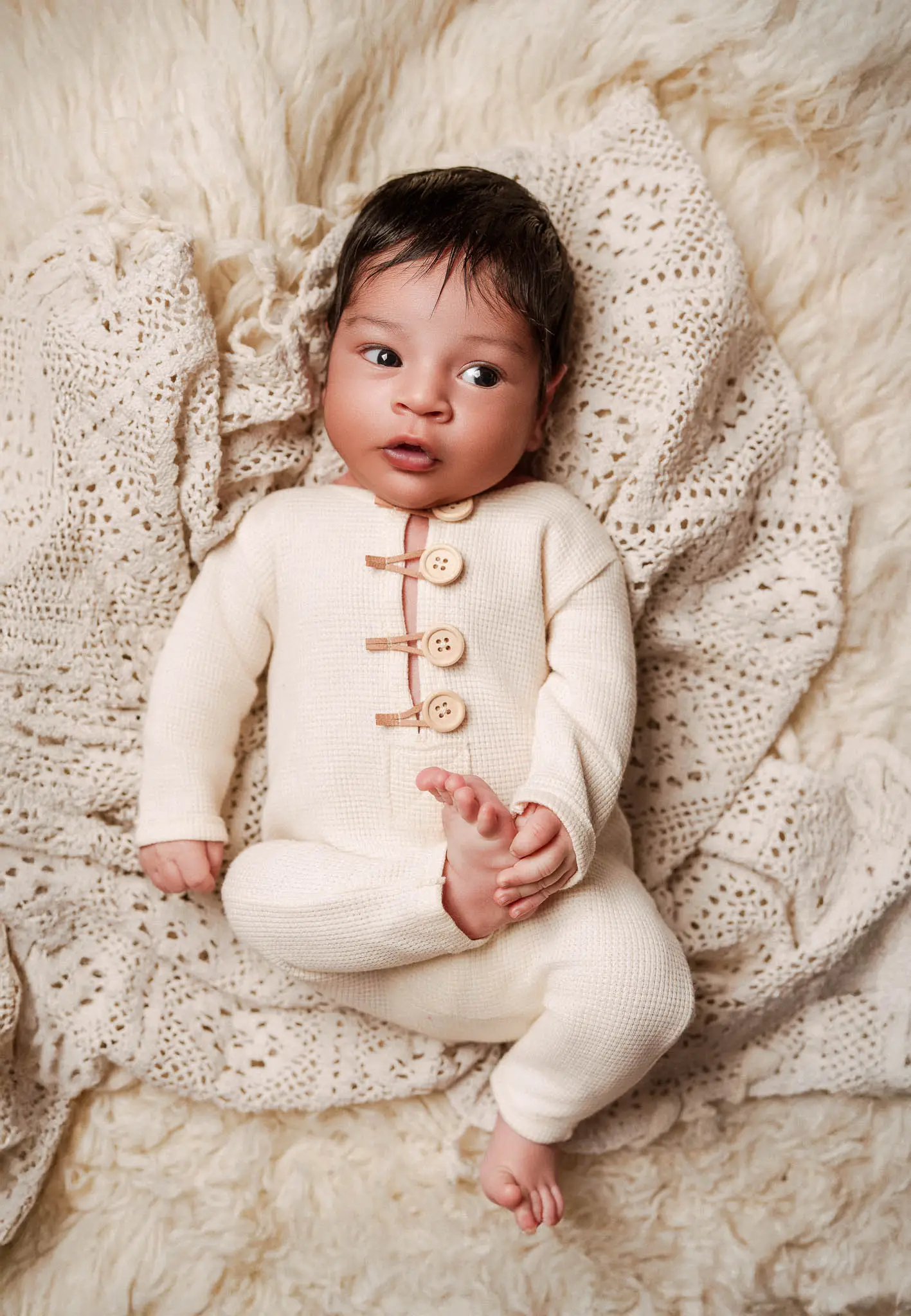 Wrapped newborn portrait with soft styling