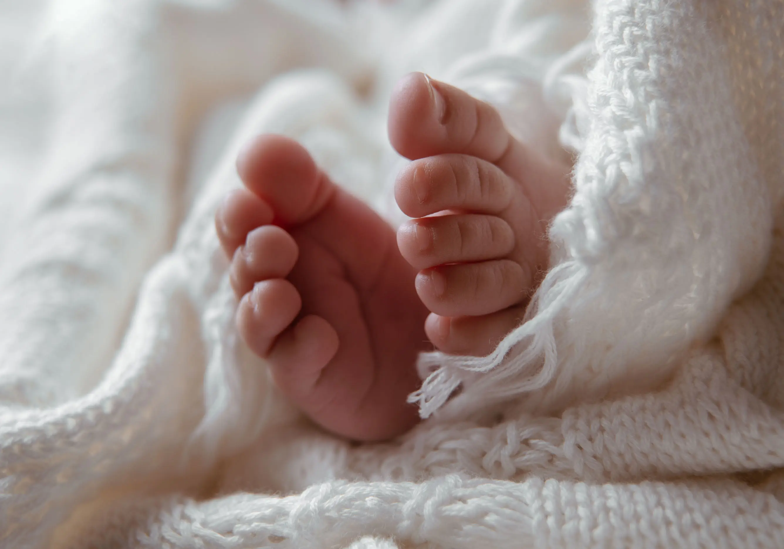 Newborn photography with gentle styling
